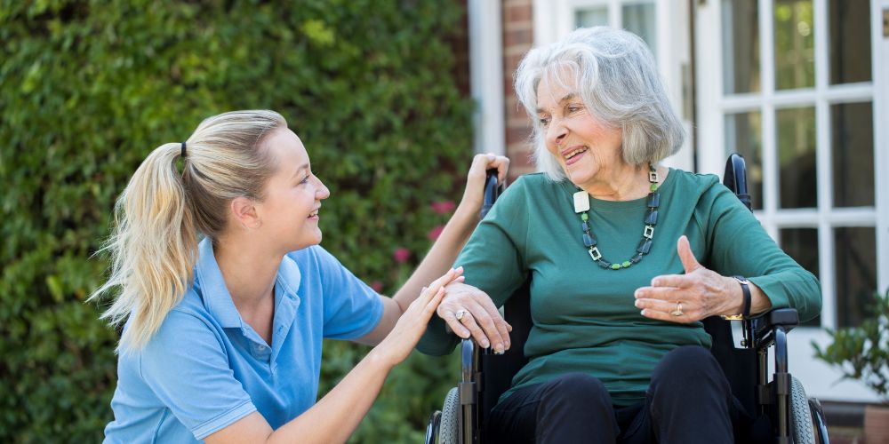 Older woman returning home after hospital discharge with support from a family member